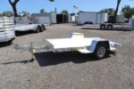 4.5x10 Aluminum Tilt Utility Trailer with a Gas Cylinder